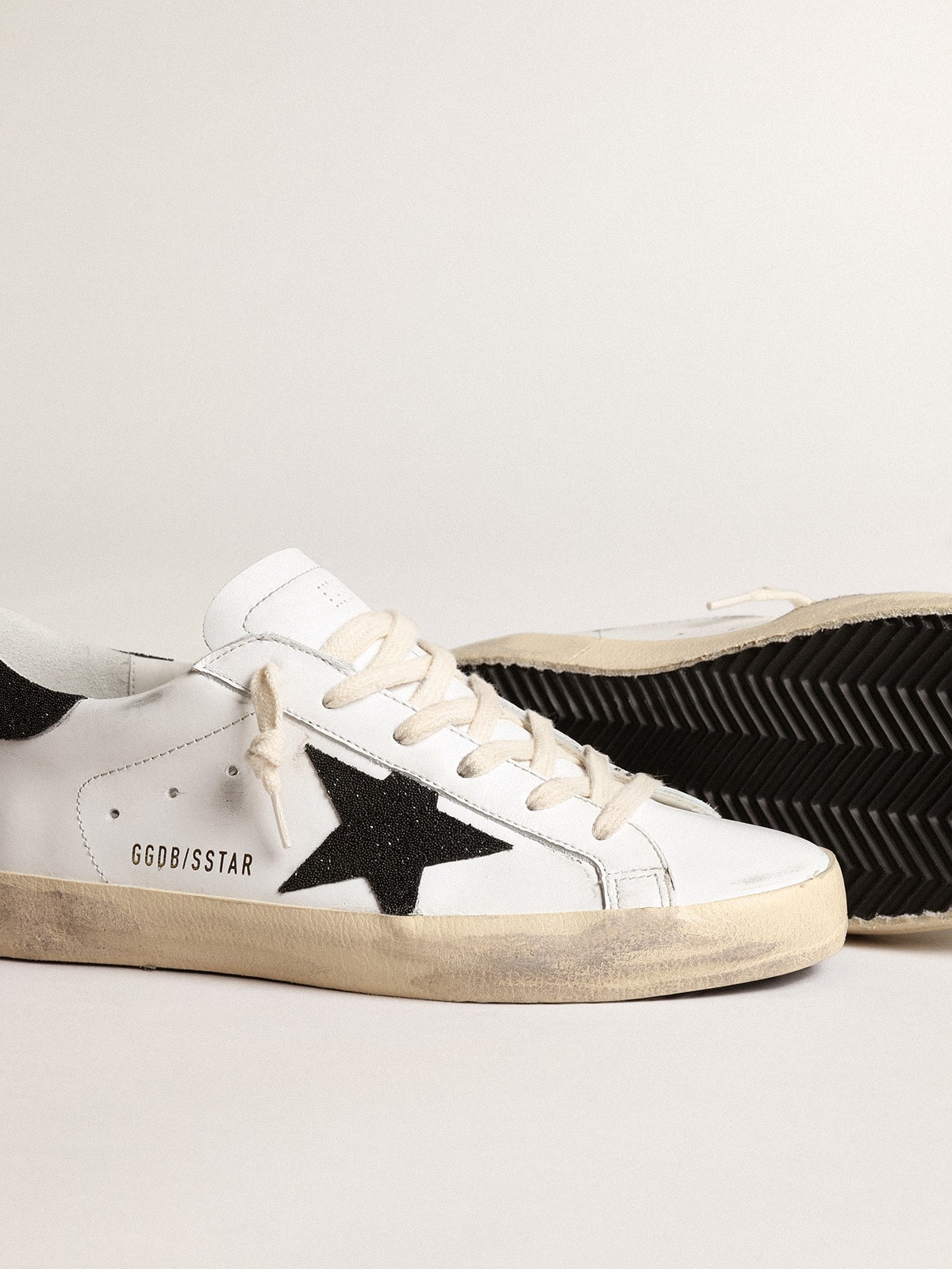 Women's White Leather Trainers with a Black Glitter Star
