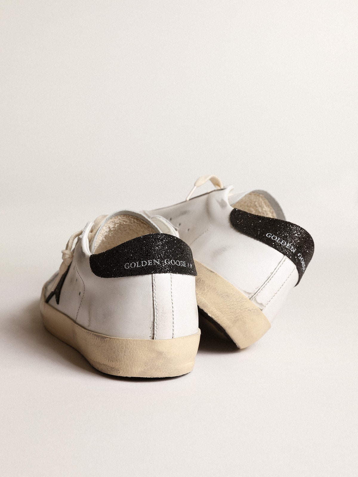 Women's White Leather Trainers with a Black Glitter Star